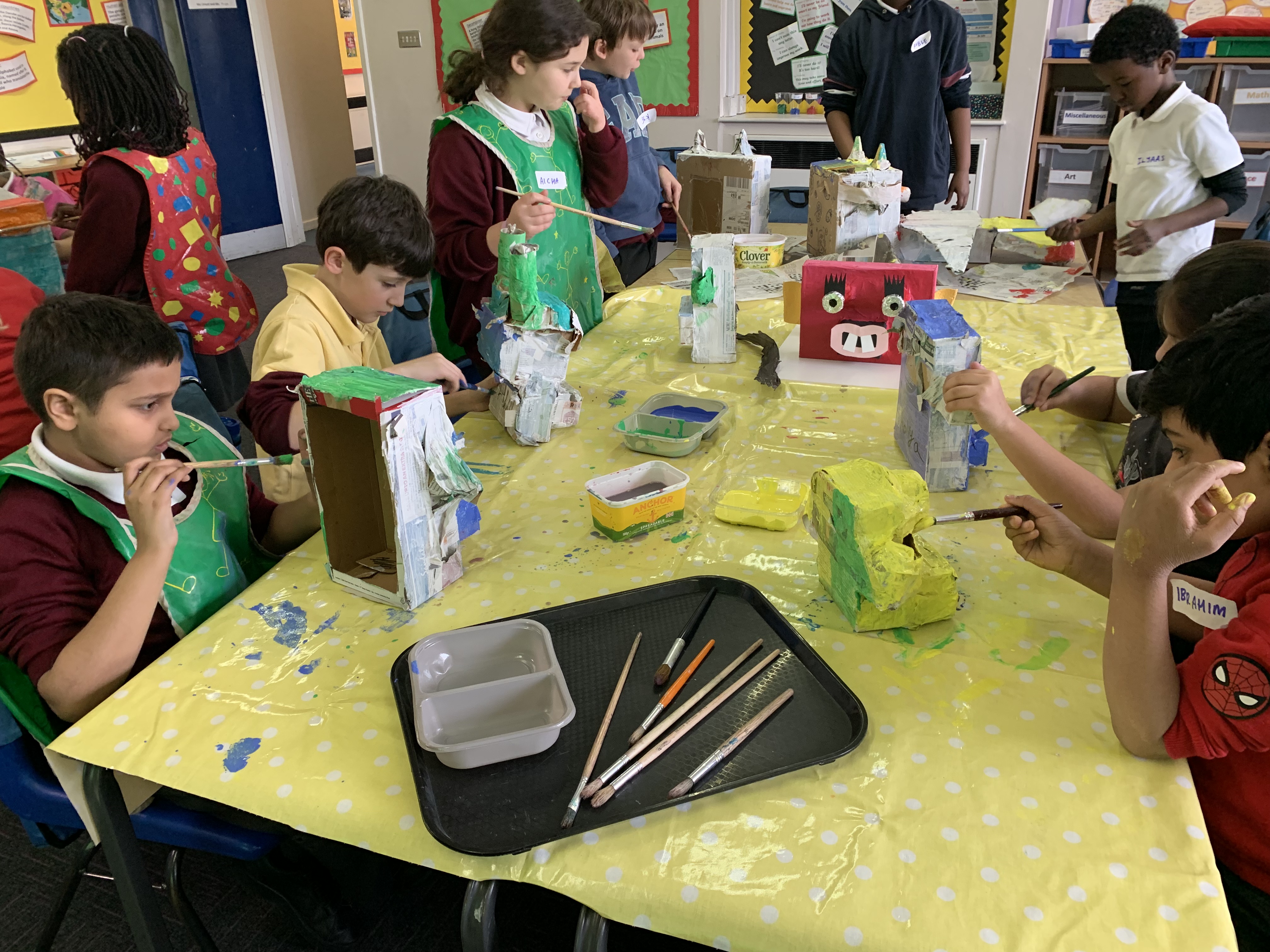 Schoolchildren paint their models